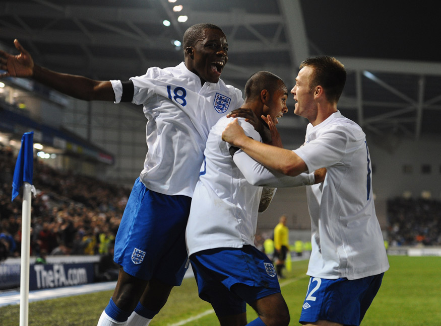 Rob Hall (centre) is congratulated on his winner against Denmark at Brighton's Amex Stadium.